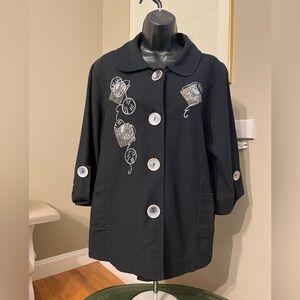 Cotton jacket with embossed design and decorative buttons.